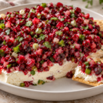 Cranberry jalapeno cream cheese dip with a fresh red and green relish